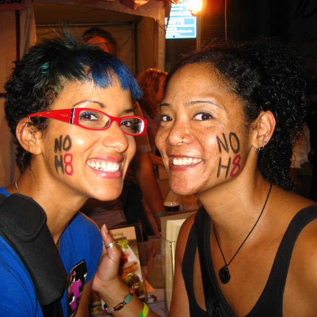 Nikhi - Before there were NOH8 tattoos, my sis and I showed our pride with black eyeliner and red lipstick.  This was at Gay Pride 2009!