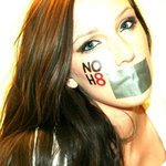 Leah Peters - I took this photo myself in my room..I drive around with the NOH8 bumper sticker & I wear the bracelet everyday! NOH8 always. <3