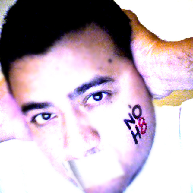Gilbert Gonzalez Jr - Gilbert Gonzalez Jr makes a homemade "NoH8" campaign photo.